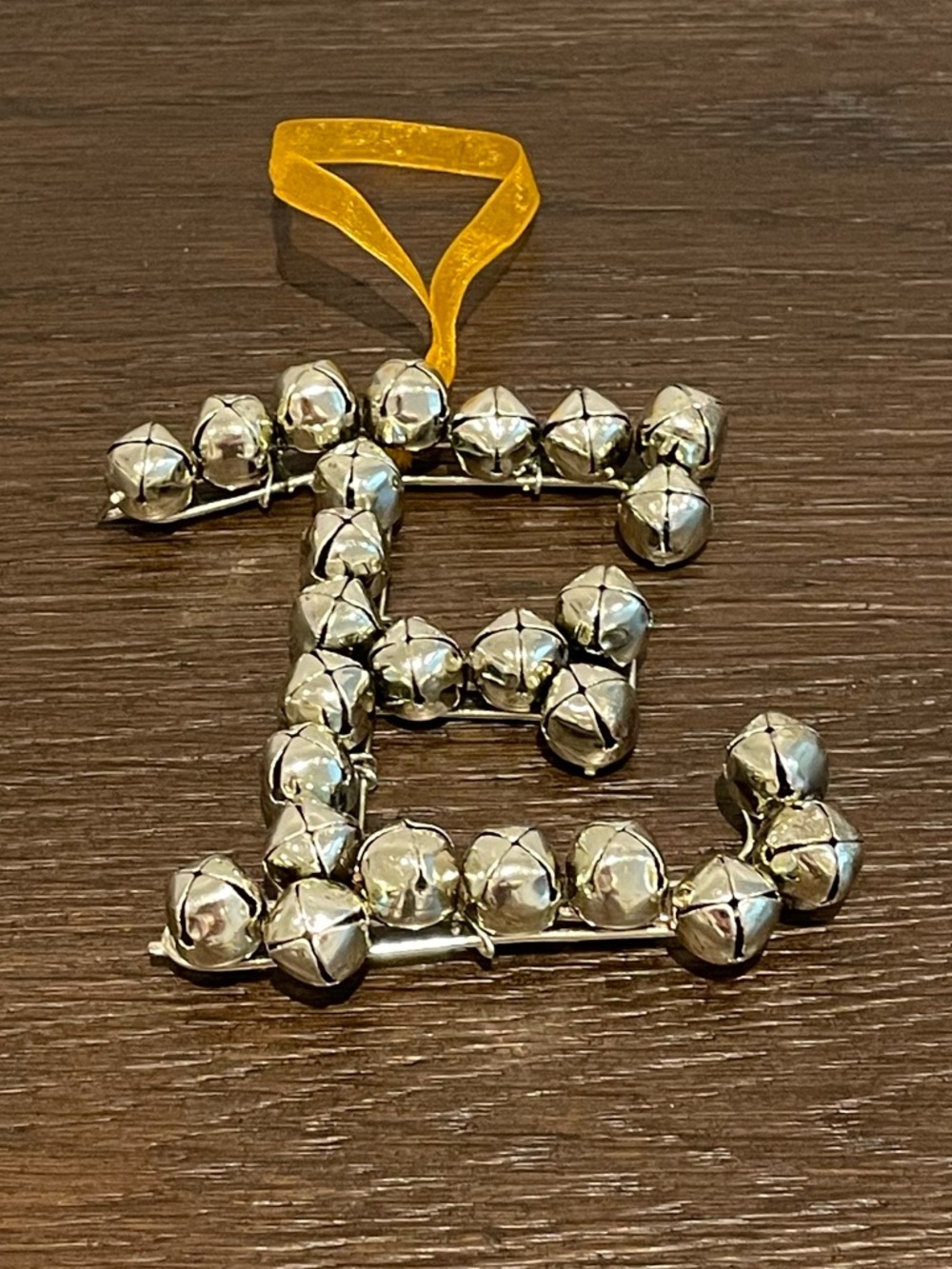 Silver Jingle Bell Letter E Ornament with Yellow Ribbon